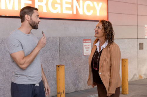 NEW AMSTERDAM -- "Give Me A Sign" Episode 506 -- Pictured: (l-r) Ryan Eggold as Dr. Max Goodwin, Aid
